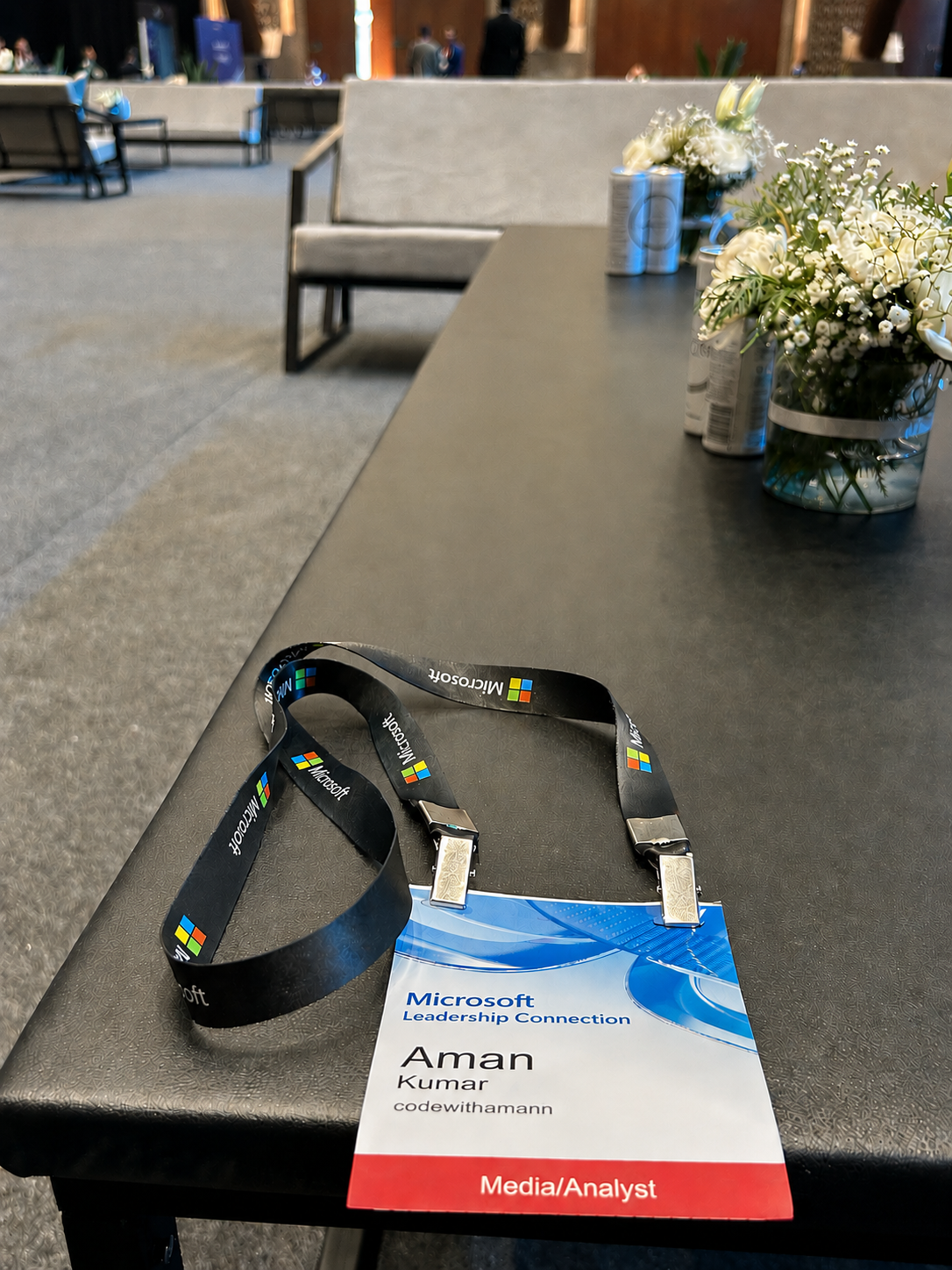 Microsoft Leadership Connection lanyard and badge for Aman Kumar on a table at the Bangalore campus